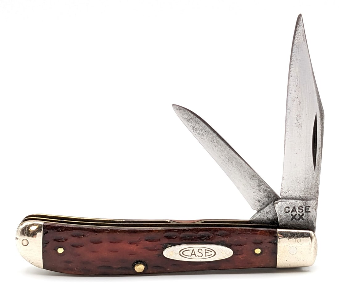 1940-64 Case XX Jigged Bone Mini Trapper 6207: Knife is in aged condition with material loss and pitting on the blades, scuffs and dings on the bolsters, and pocket worn handle scales. Overall measures 3-1/2in when closed.