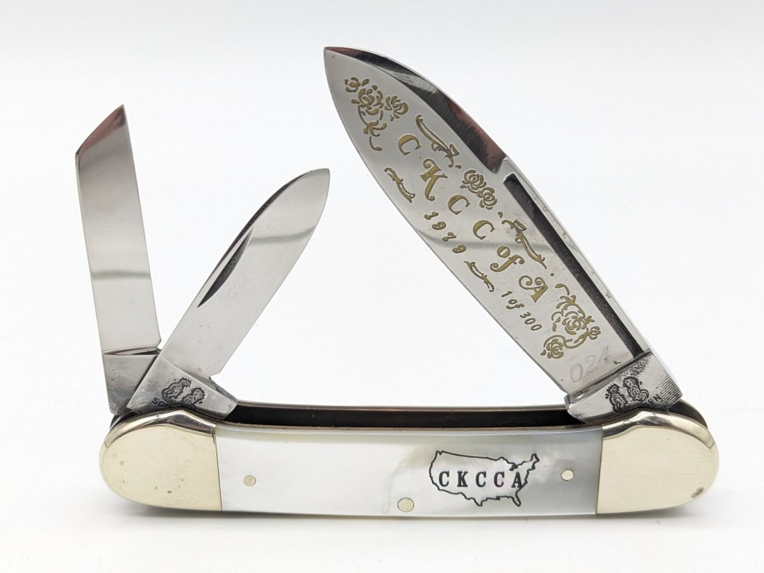 Ltd 1979 Frank Buster Fight'n Rooster CKCCA Mother of Pearl Canoe Knife: Knife is numbered 024 of 300 and is in very nice condition with light scuffs and tarnish on the bolsters from handling. Overall measures 3-3/4in when closed.