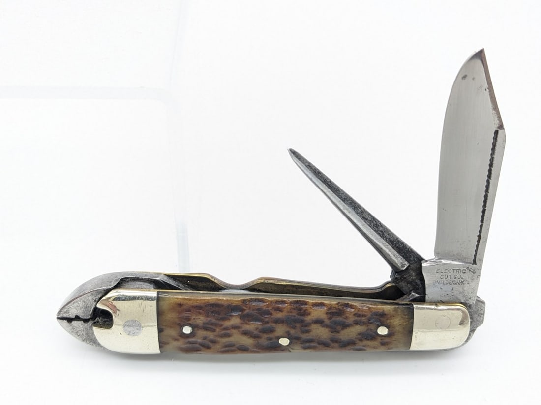 Antique Electric Cut Co. Jig Bone Multi Tool: Knife is in nice used condition with a cleaned blade with some material loss from sharpening, scuffs and dings on the bolsters, and nice pocket worn handle scales. Overall measures 4-1/4in when closed