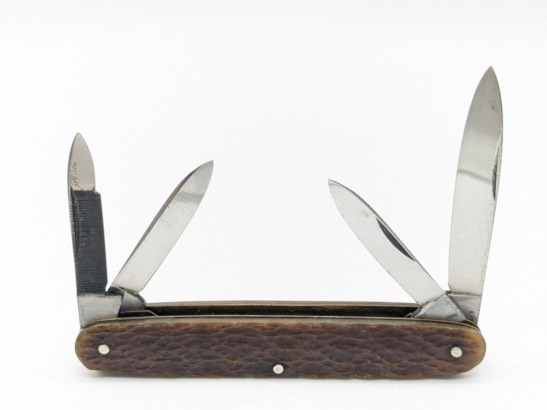 A. & A. Mfg. Co. Solingen Full Jig Bone 4-Blade Pocket Knife: This is a unique knife with full jig bone handle scales with no bolsters. Knife is in very nice condition with minimal wear on the blades, and minimal wear on the handle scales from age. Overall measu