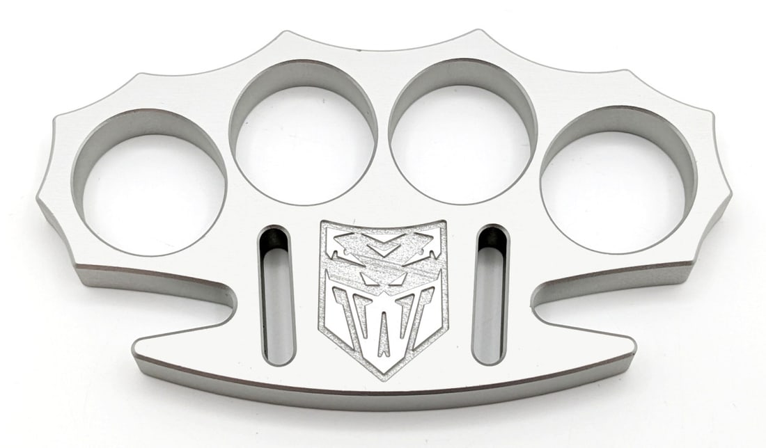 NIB CobraTec CNC T6 Aviation Aluminum Silver Knuckles: Knuckles are in new condition. Overall measures 4-3/4in across.