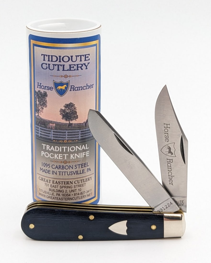 Great Eastern Cutlery Blue Linen Micarta Two-Blade 391224 w/ Tube: Knife includes a Tidioute Horse Rancher promotional button. Knife is in very nice condition with light wear from handing. Overall measures 3-1/2in when closed.