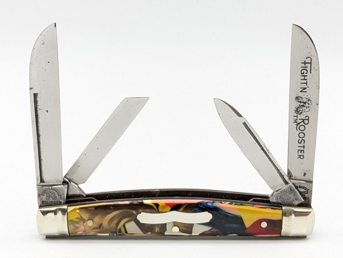 Frank Buster Fight'n Rooster Multi Color Acrylic Congress Knife: Knife is in nice condition with light carbon spots on the blades, and some tarnishing on the bolsters from handling. Overall measures 3-3/8in when closed.