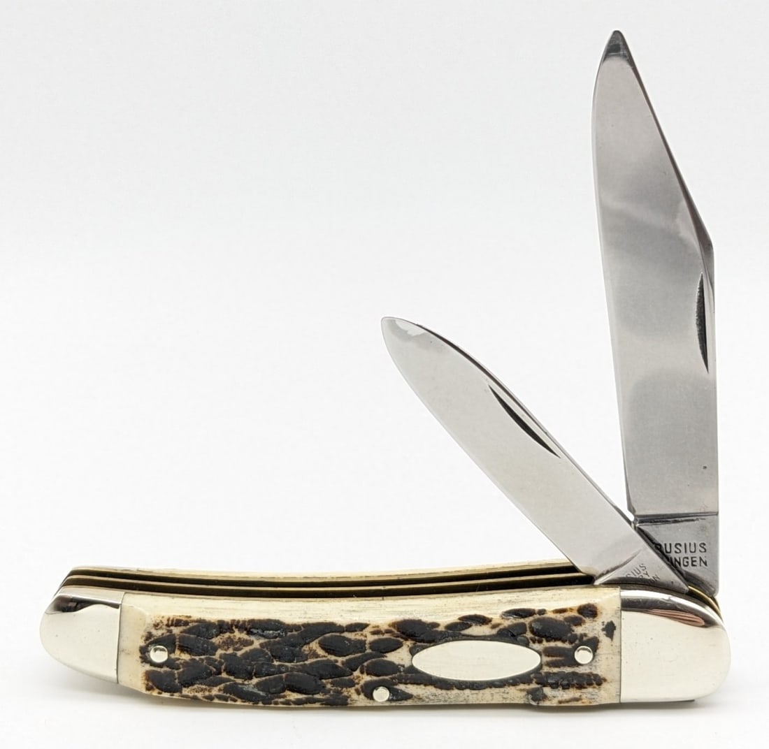 Krusius Solingen Jigged Bone 2-Blade Whittler: Knife is in very nice condition with light scuffs from handling. Overall measures 3-1/2in when closed.