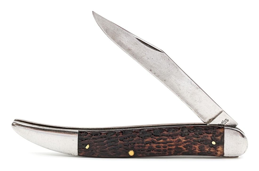 Antique Remington Jigged Bone Large Toothpick Knife: Knife is in fair aged condition with material loss and scratches on the blade, and scuffs and tarnishing on the bolsters. Overall measures 5in when closed.