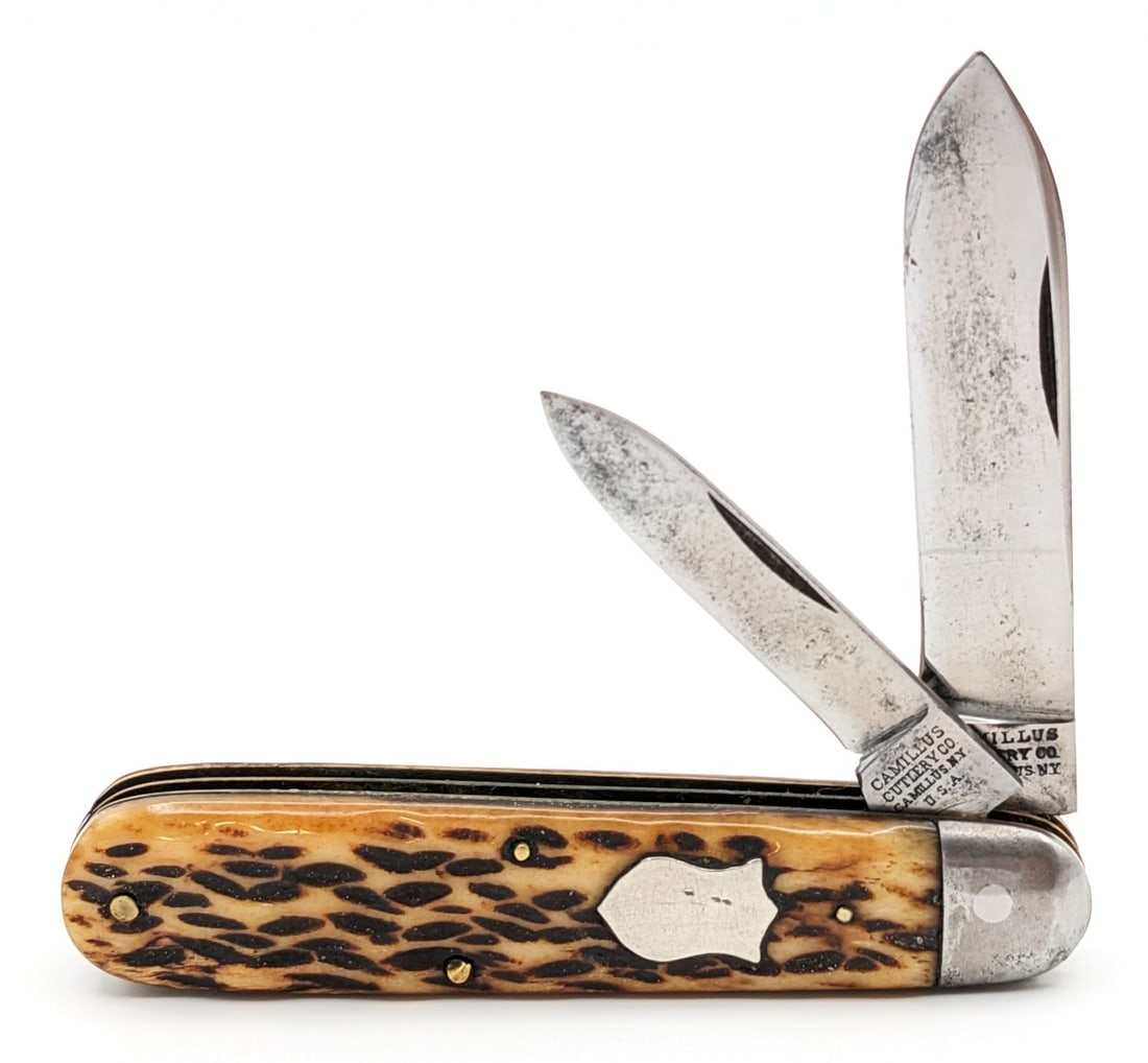Antique Camillus Cutlery Co. Jigged Bone Jack Knife: Knife is in good cleaned condition with some material loss and carbon spots on the polished blades, and some scuffs and dings on the bolsters. Overall measures 3-3/8in when closed.