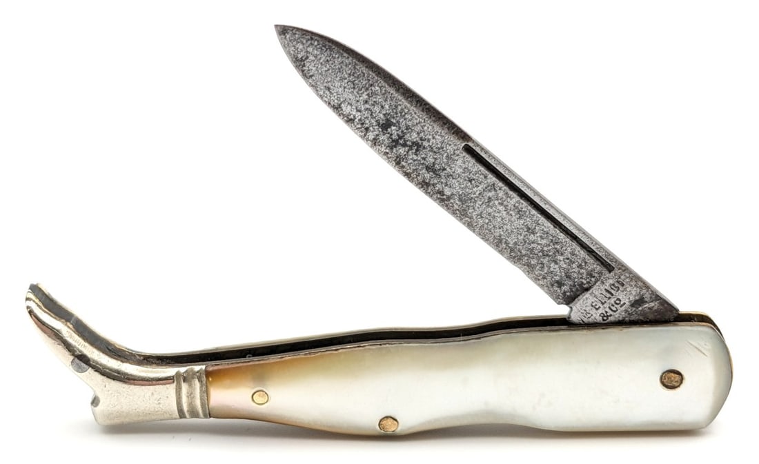 WR Elliot & Co. Mother of Pearl Shoe Knife: Knife is in fair condition with carbon spotting and wear on the blade, scuffs and light dings on the bolsters, and nice handle scales. Overall measures 2-5/8in when closed.