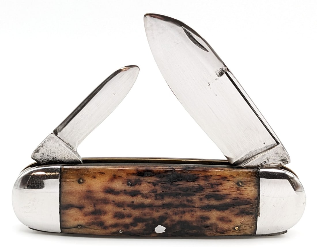 Wilbert Cutlery Co. Jigged Bone Elephants Toe Sunfish Knife: Knife is in good cleaned condition with material loss and some scratches on the polished blades, light scuffs on the polished bolsters, and pocket worn handle scales with some small pin cracks on the