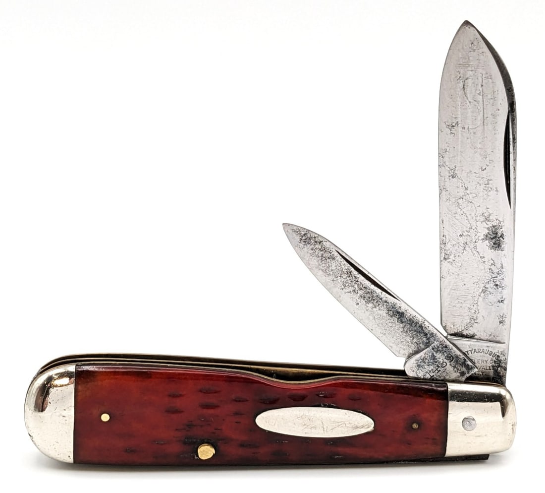 Cattaraugus Cutlery Co. Pocket Worn Red Bone Jack Knife: Knife is in good cleaned condition with scratches and carbon spotting on the polished blades, scuffs and some dings on the polished bolsters, and nice pocket worn handle scales. Overall measures 3-3/8