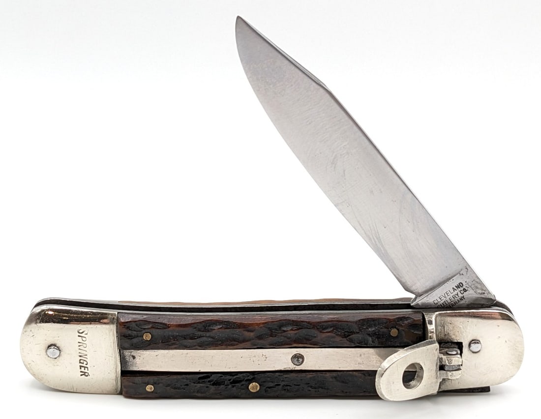 Cleveland Cutlery Co. Germany Springer Jigged Bone Leverlock Switchblade: Knife is in good condition with light scratches on the blade, scratches and dings on the bolsters, and nice handle scales. Knife has a very strong spring, locks tight when open, and peaks very slightl