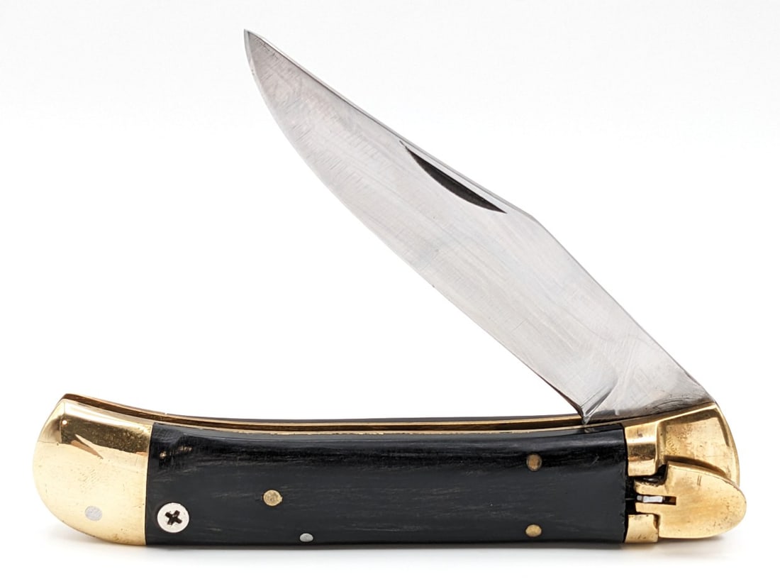 Unmarked Smooth Wood Leverlock Switchblade Knife: Knife is in fair condition with light scratches on the blade, some scuffs and tarnishing on the bolsters, and a repaired pin on the front handle scale. Knife has a strong spring, and locks tight when