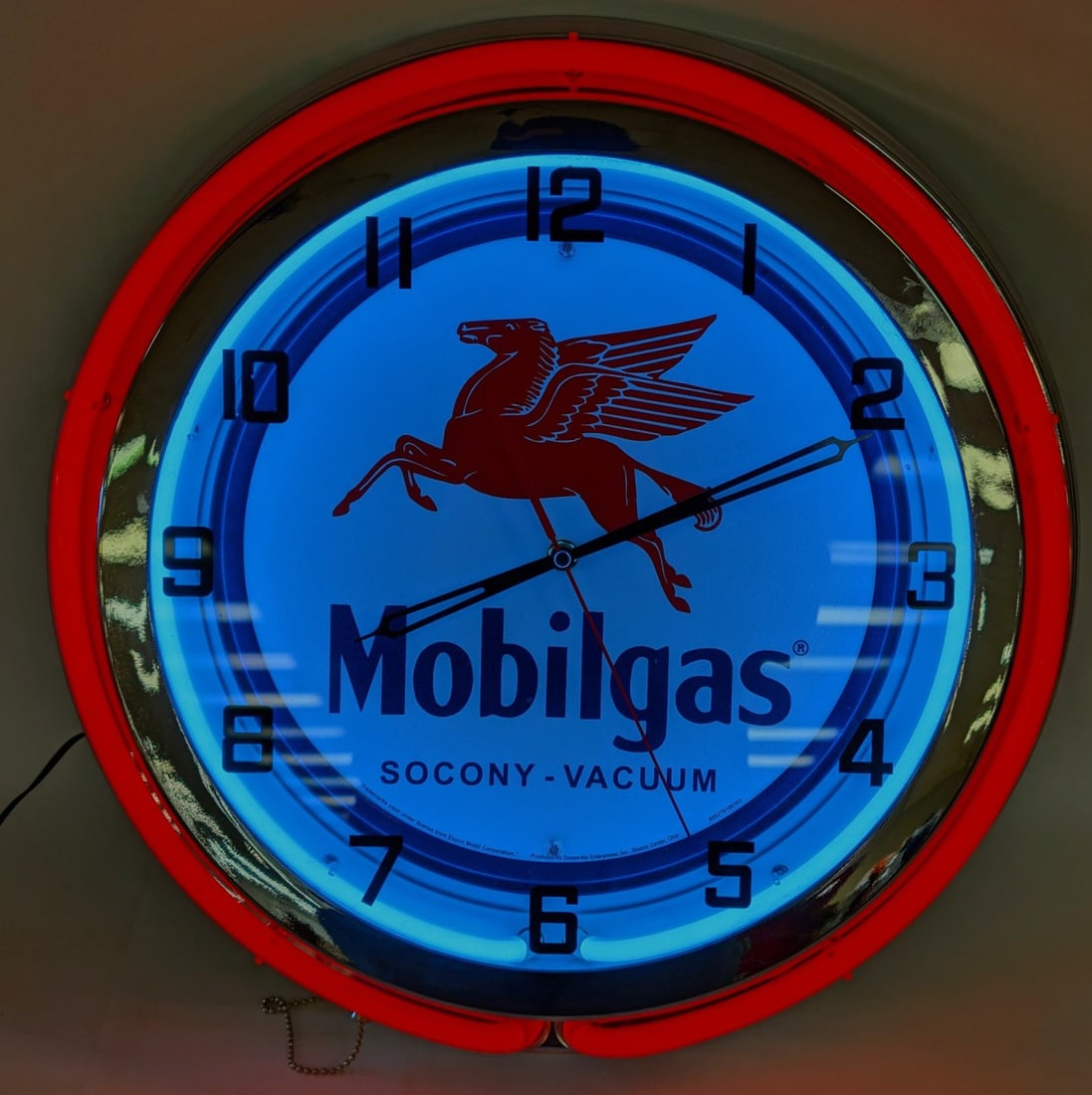Mobilgas 2-Color Neon Wall Clock: Clock is in nice working condition with good looking neon. Measures 19in in diameter.