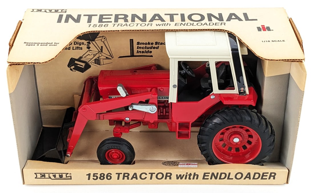 1/16 Ertl International 1586 Tractor with Loader: 1/16 Ertl International 1586 tractor with loader in the original box. Box and tractor are in great condition overall.