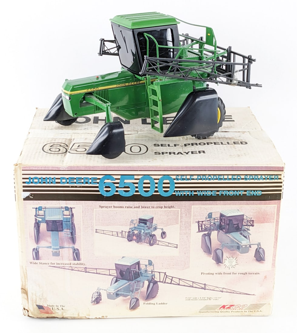 1/16 KZCO John Deere 6500 Self-Propelled Sprayer w/ Wide Front: 1/16 KZCO John Deere 6500 self-propelled sprayer with wide front end. The sprayer is in good condition in the box. The box has some staining and discoloration. A nice harder to find sprayer.