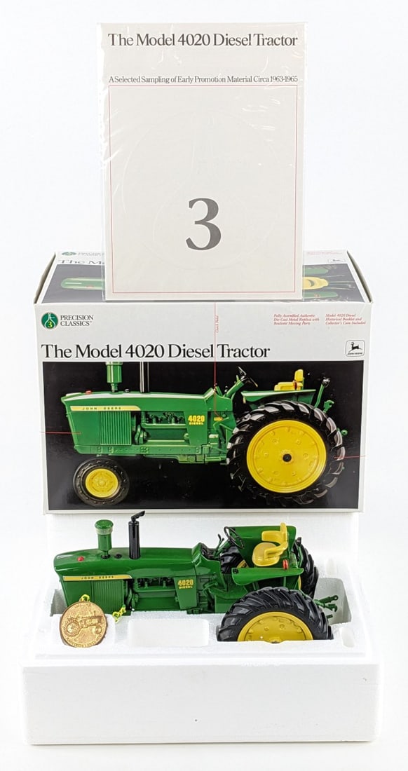 1/16 Ertl John Deere Model 4020 Diesel Narrow Front Tractor Precision Series #3: 1/16 Ertl John Deere Model 4020 diesel narrow front tractor. Precision Classics Series #3. The tractor has light dust from display. It comes with the booklet and collector's coin.