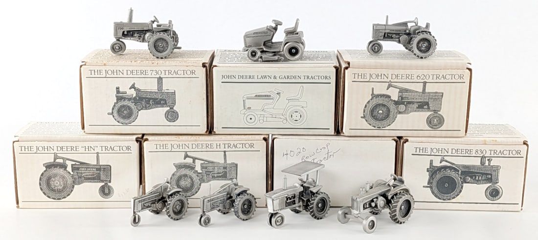(7) 1/43 Scale SpecCast John Deere Pewter Tractors: 1/43 Scale SpecCast John Deere 730 tractor, JD 620 tractor, JD model "HN", JD Model "H", JD 830 tractor, 4020 row crop tractor, and JD 325 L&G tractor.