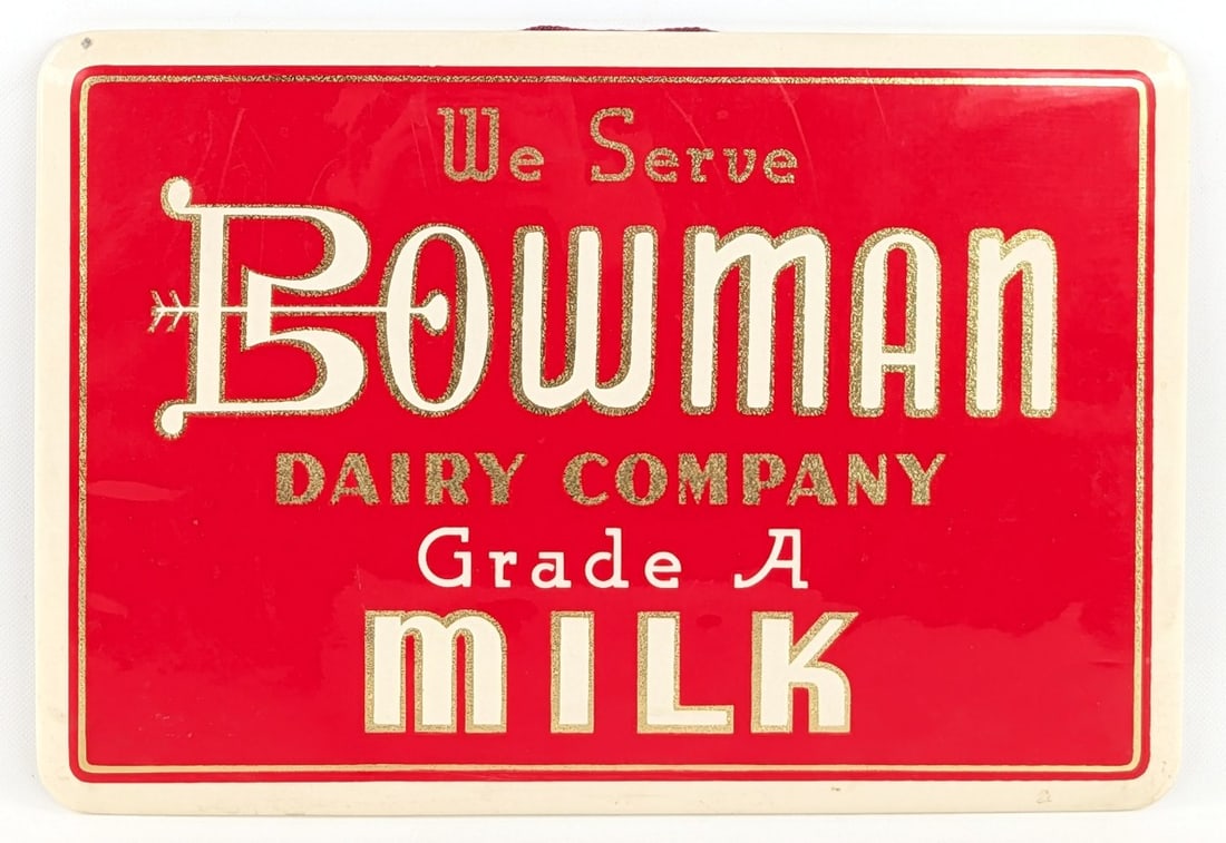 Early Bowman Dairy Co. Milk Celluloid Adv Sign: Early Bowman Dairy Company Grade A Milk celluloid easle back countertop advertising sign. Nice condition with some scuffs and wear from use and age. Displays well. Measures approximately 11" across by