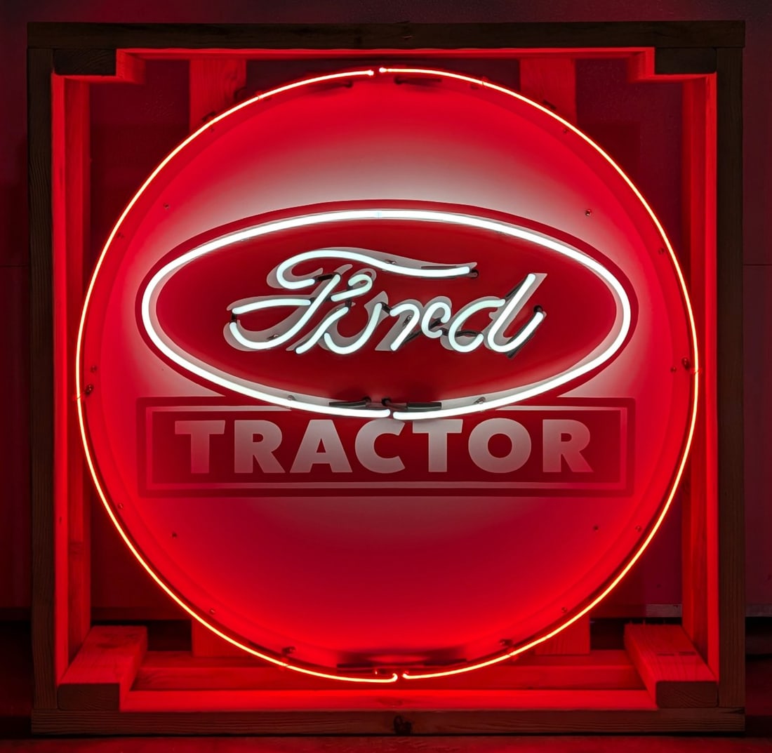 Custom Ford Tractor Neon Sign: Custom Ford Tractor neon advertising sign. The sign features new neon glass, transformers and wiring on a metal can with hanging brackets. Measures approximately 36" in diameter.