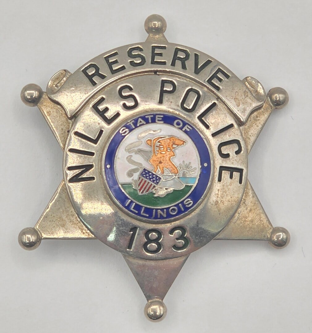 Obsolete C.H. Hanson Niles Illinois Reserve Police Star Badge #183: Obsolete Niles, Illinois Reserve Police 6-Point Star Badge #183 with ball tips. Badge is in nice condition with a pin back, has some age and use wear. Maker marked C.H. Hanson. It measures approximate