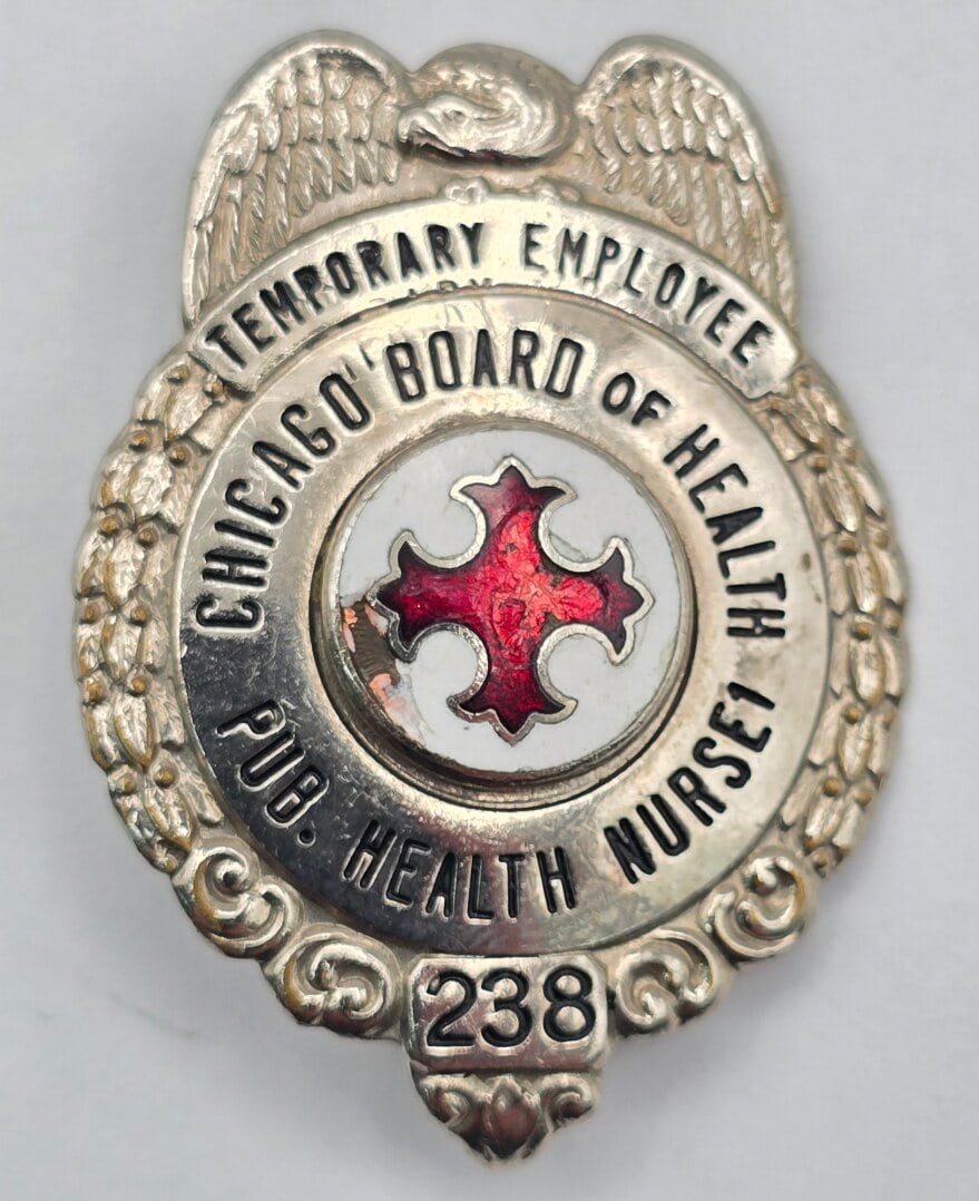 Obsolete C.H. Hanson Chicago Board Of Health Public Health Nurse 1 Badge #238: Obsolete Chicago Board Of Health Public Health Nurse 1 Shield Badge #238. Top of badge reads "Temporary Employee". Badge is in good condition with a pin back, has some age and use wear with a chip in