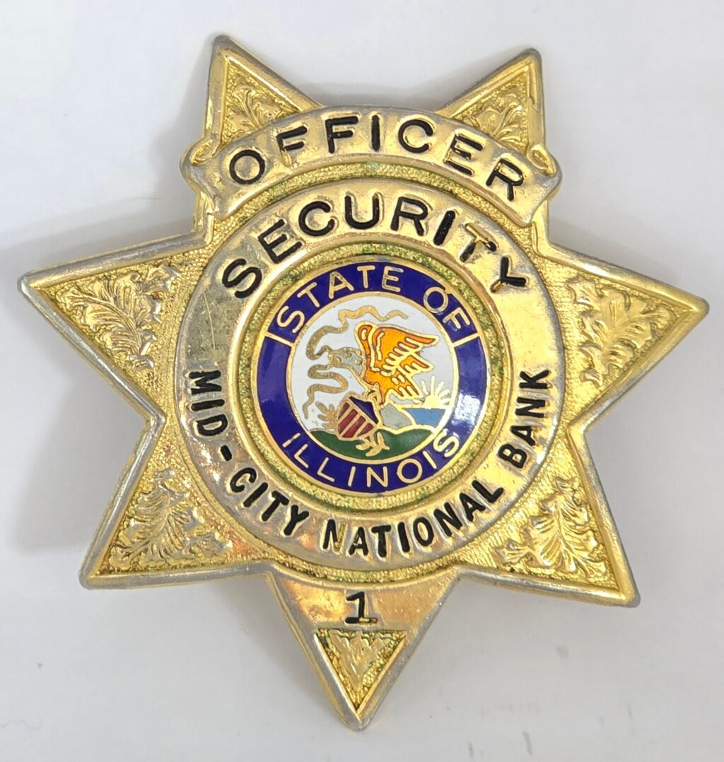 Obsolete Meyer & Wenthe Mid-City National Bank Chicago Security Officer 7-Point Star Badge #1: Obsolete gold-tone Meyer & Wenthe Mid-City National Bank Chicago 7-Point Star Badge #1. Badge is in good condition with a pin back, has some age and use wear. Maker marked Meyer & Wenthe Chicago. It m