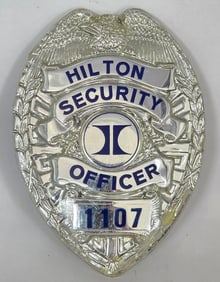 Obsolete Hilton Security Officer Plastic Shield Badge #1107