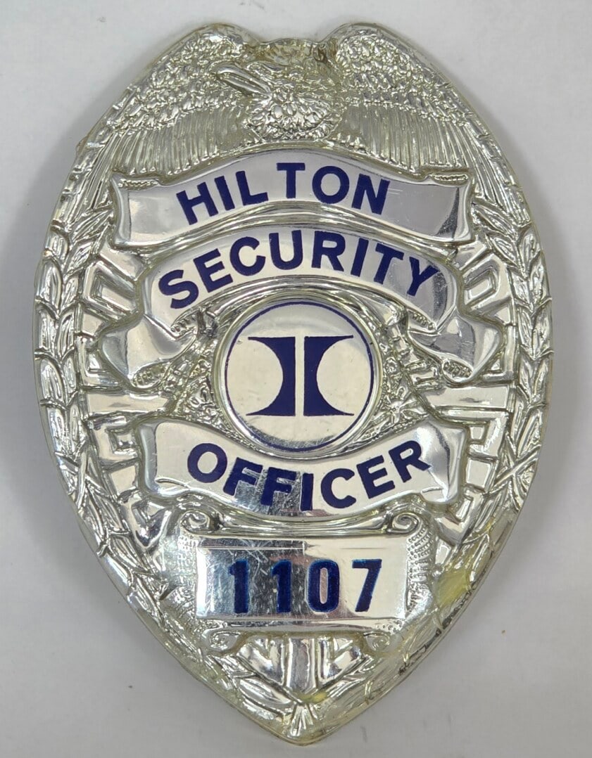 Obsolete Hilton Security Officer Plastic Shield Badge #1107 (1 of 2)