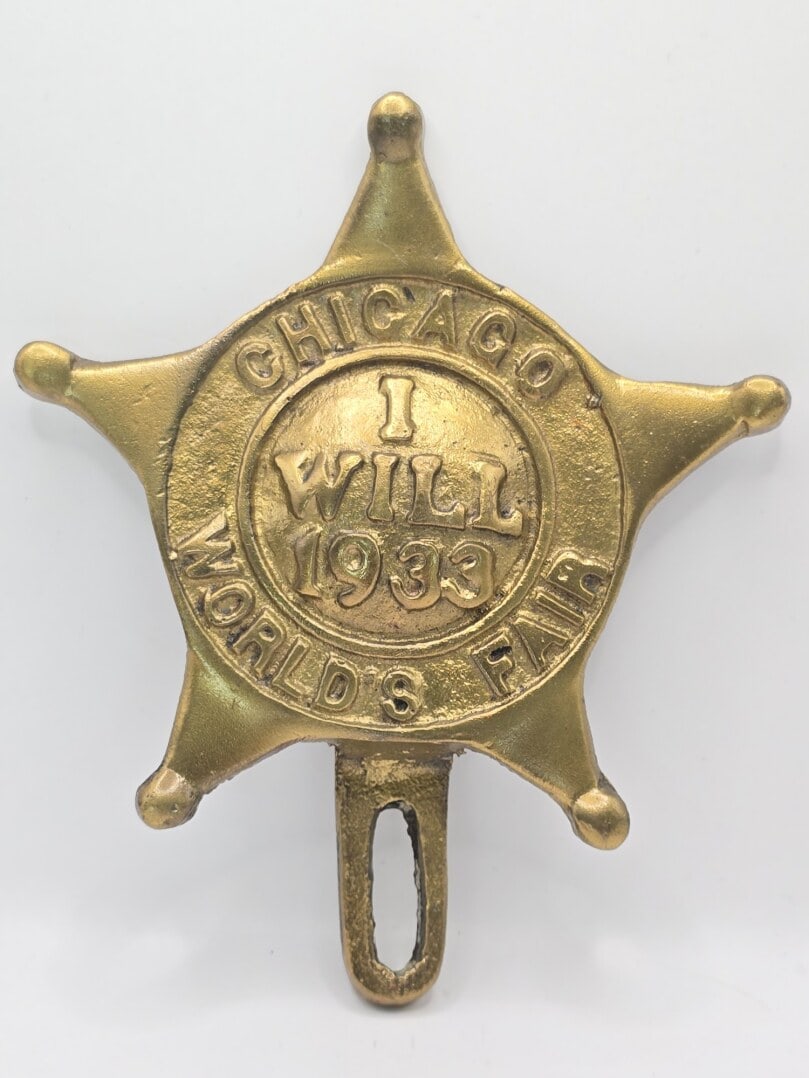 Obsolete Chicago World's Fair "I Will 1933" Brass Plate Topper: Obsolete Chicago World's Fair "I Will 1933" Plate Topper. The heavy brass topper is in nice condition and overall measures approximately 4-1/2" across x 5-3/8" tall including the mount.