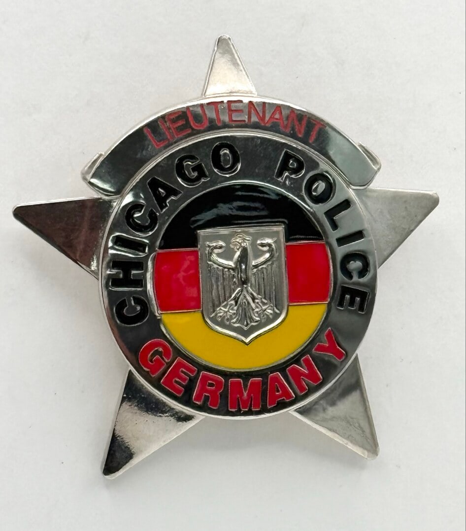 Obsolete Newer Chicago Police Lieutenant Germany Nationality Badge: Obsolete Newer Chicago Police Lieutenant Germany 6-Point Star Nationality Badge. Badge is in nice condition with a pin back, has little to no wear. No maker mark. It measures approximately 2-3/4" tall