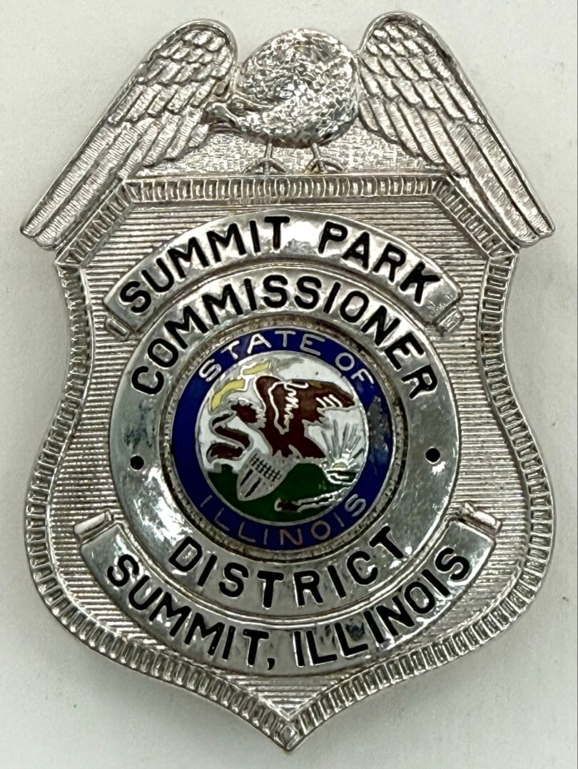 Obsolete Summit Illinois Summit Park District Commissioner Shield Badge: Obsolete Summit Illinois Summit Park District Commissioner Shield Badge. The badge is in nice condition with a pin back, has some light age and use wear. No maker mark. Badge measures approximately 2-