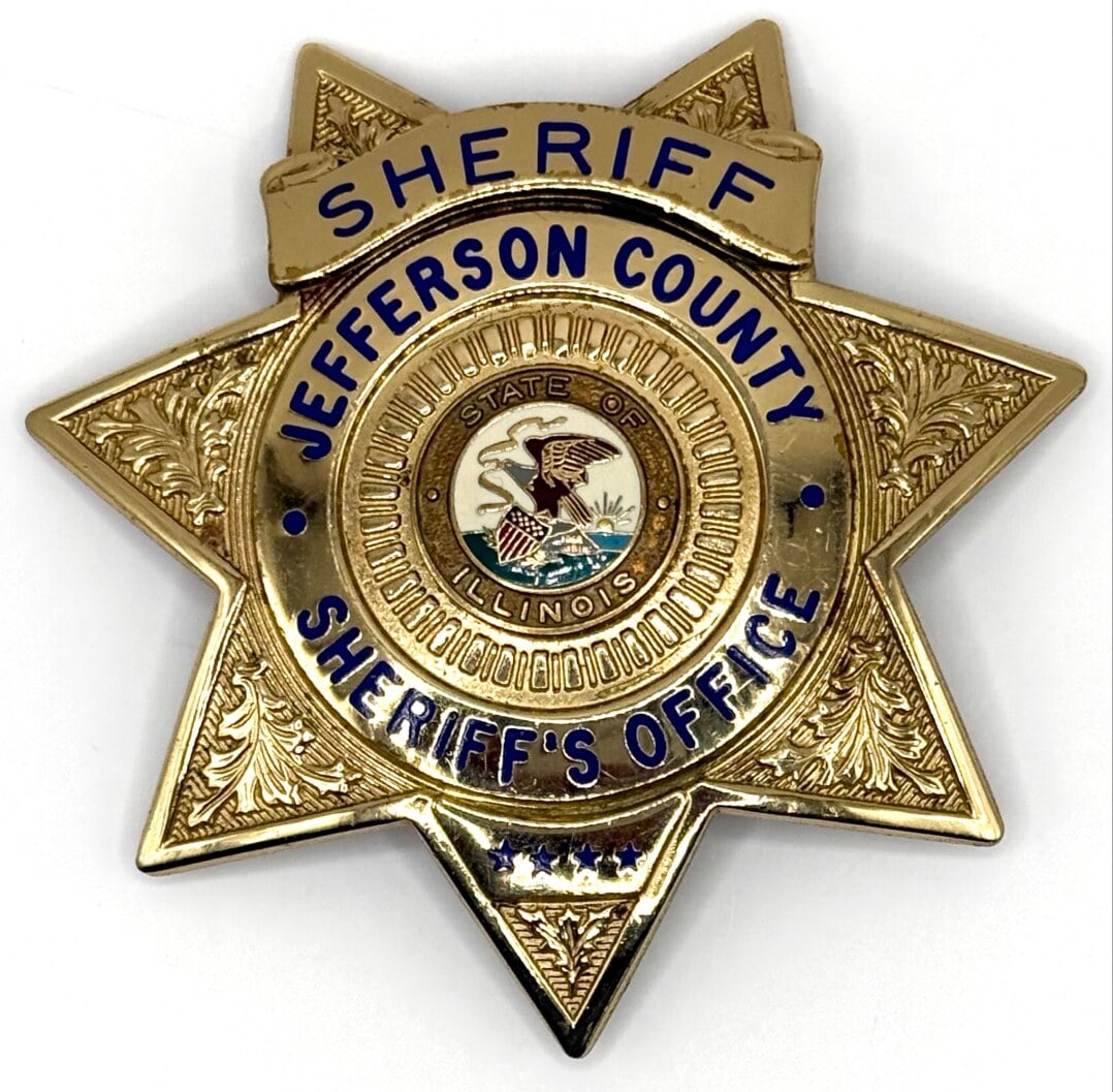 Obsolete Blackinton Jefferson County Illinois Sheriff Star Badge: Obsolete Jefferson County Illinois Sheriff 6-Point Star Badge with ball tips. The badge is in nice condition with a pin back, has some age and use wear. Maker marked Blackinton. Badge measures approxi