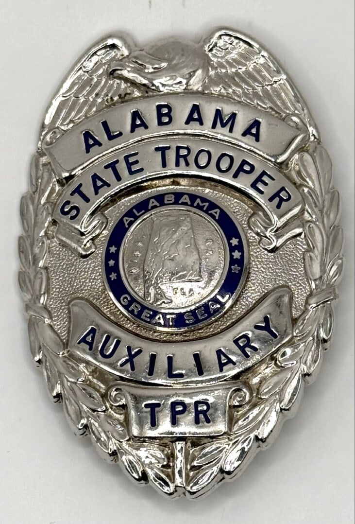 Obsolete Alabama State Trooper Auxiliary TPR Shield Badge: Obsolete Alabama State Trooper Auxiliary TPR Shield Badge. The badge is in nice condition with a pin back, has some light age and use wear. No maker mark. Badge measures approximately 3-1/8" tall by 2