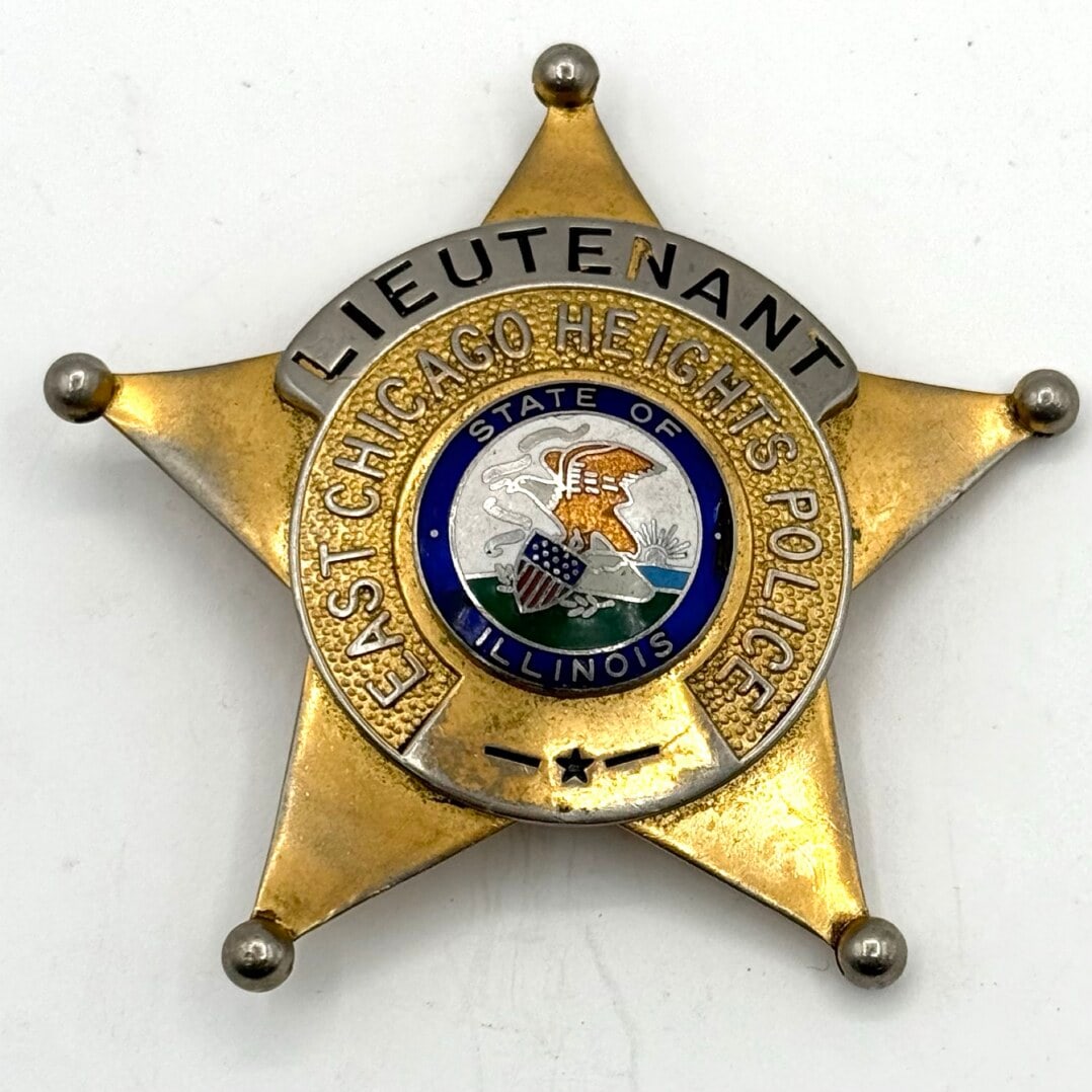 Obsolete C.H. Hanson East Chicago Heights Illinois Police Lieutenant 5-Point Star Badge: Obsolete East Chicago Heights Illinois Police Lieutenant 5-Point Star Badge with ball tips. The gold-tone badge is in good condition with a pin back, has age and use wear. Maker marked C.H. Hanson Chi