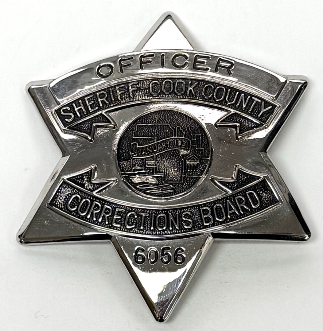 Obsolete Sheriff-Cook County Corrections Board Officer Star Badge #6056: Obsolete Sheriff-Cook County Corrections Board Officer 6-Point Star Badge. The badge has a pin back and shows some light age and use wear. No maker mark. Badge measures approximately 3-1/8" tall by 2-