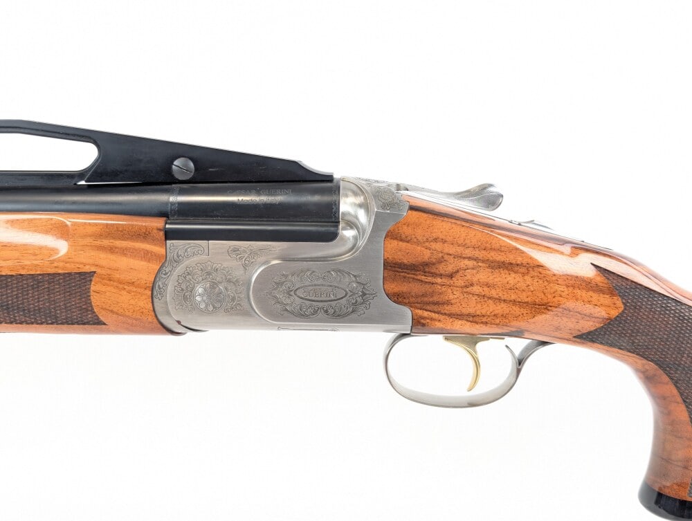 Caesar Guerini Summit Compact Trap 12 Ga 2 Barrel Set O/U Shotgun w/ Case: Manufacturer: Caesar Guerini, Model: Summit Compact Trap, Type: Shotgun, Caliber/Gauge: 12 Ga, Barrel: 30 inch Double & 32 inch Unsingle w/ High Adjustable Rib, Choke: Screw In, Finish: Nickel, Grip: