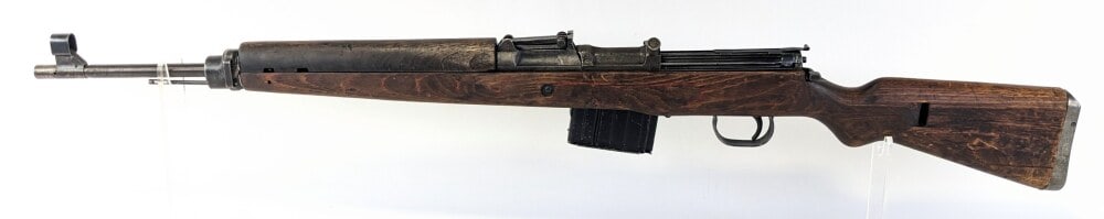 WWII German 1944 Walther G43 7.92 x 57mm Semi Auto Rifle: Manufacturer: Walther, Model: G43, Type: Rifle, Caliber/Gauge: 7.92 x 57mm, Barrel: 21-3/4 inch, Choke: , Finish: Bare Metal, Grip: , Stock: Wood, Condition: Fair with heavy finish wear, rough casting