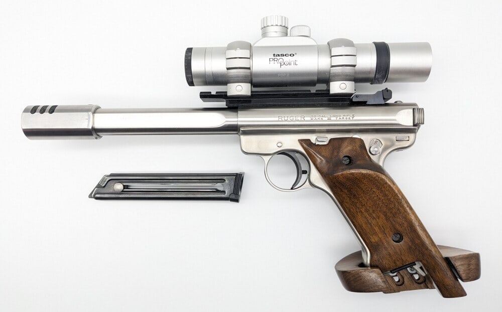 Custom Ruger Mark II Target .22 LR Semi Auto Pistol: Manufacturer: Ruger, Model: Mark II , Type: Pistol, Caliber/Gauge: .22 LR, Barrel: 7 inch , Choke: , Finish: Stainless Steel, Grip: Custom Adjustable Smooth Wood, Stock: , Condition: Nice with light s