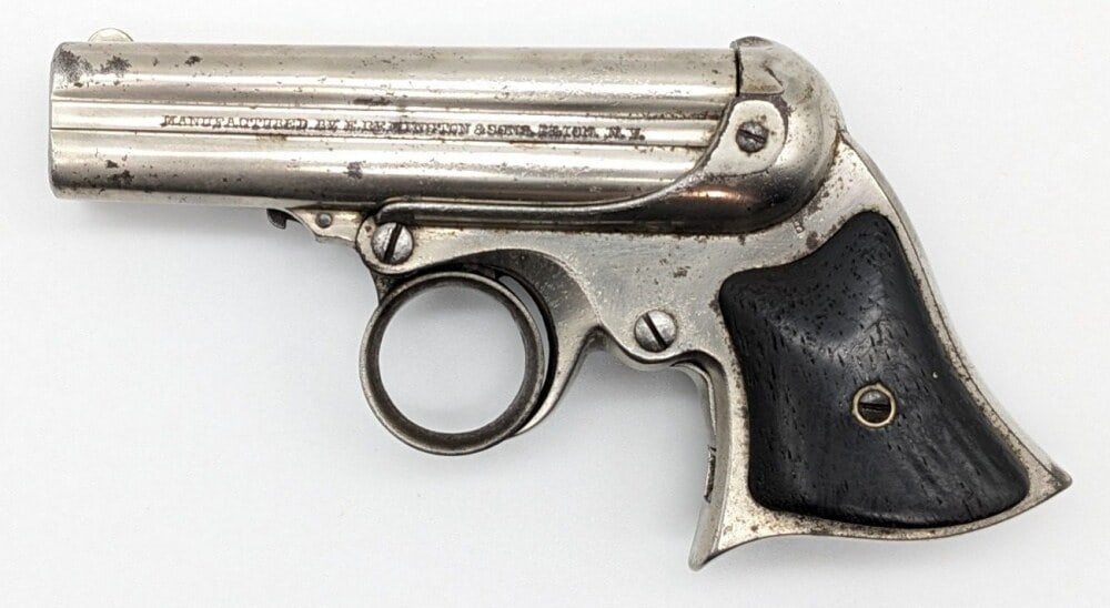 Remington Elliot .32 Cal Ring Trigger 4-Barrel Derringer: Manufacturer: Remington & Sons, Model: Ring Trigger, Type: Derringer, Caliber/Gauge: .32 Cal, Barrel: 3-3/8 inch, Choke: , Finish: Nickel, Grip: Smooth Wood, Stock: , Condition: Fair aged condition wi