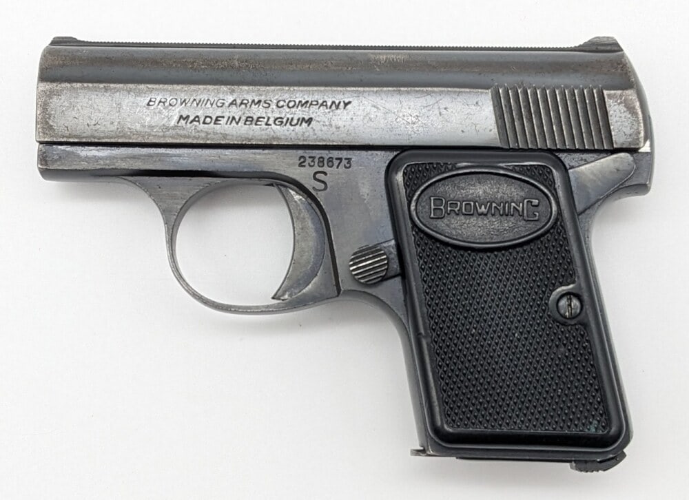 Belgian Baby Browning .25 ACP Semi Auto Pistol: Manufacturer: Browning , Model: Baby Browning , Type: Pistol, Caliber/Gauge: .25 ACP, Barrel: 2 inch, Choke: , Finish: Blued, Grip: Checkered Plastic, Stock: , Condition: Aged with heavy finish wear a