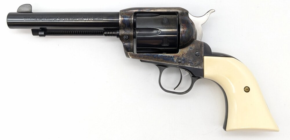 Ruger Vaquero .45 LC Single Action Revolver: Manufacturer: Ruger, Model: Vaquero, Type: Revolver, Caliber/Gauge: .45 LC, Barrel: 5-1/2 inch, Choke: , Finish: Blued & Color Case Hardened, Grip: White Plastic, Stock: , Condition: Very nice with li