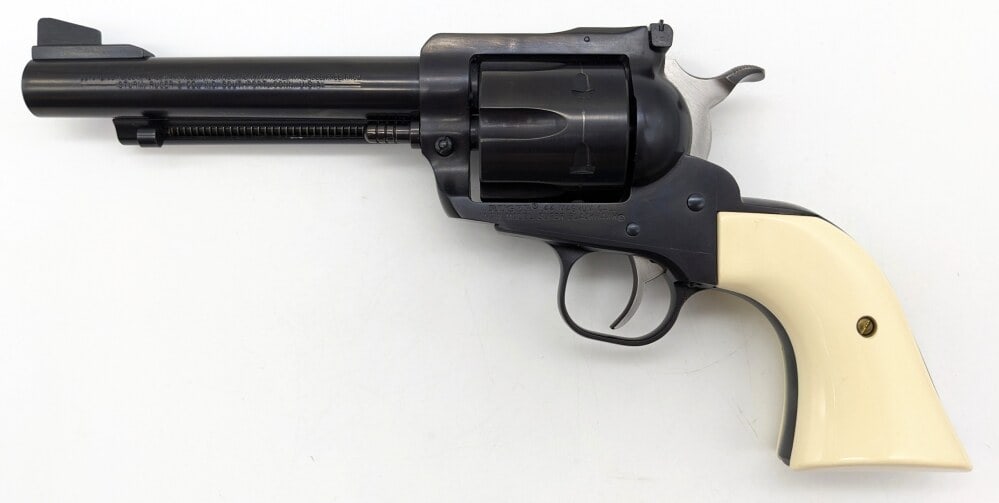 Ruger New Model Super Blackhawk .44 Magnum Revolver: Manufacturer: Ruger, Model: New Model Super Blackhawk, Type: Revolver, Caliber/Gauge: .44 Mag, Barrel: 5-1/2 inch, Choke: , Finish: Blued, Grip: White Plastic, Stock: , Condition: Very nice with light
