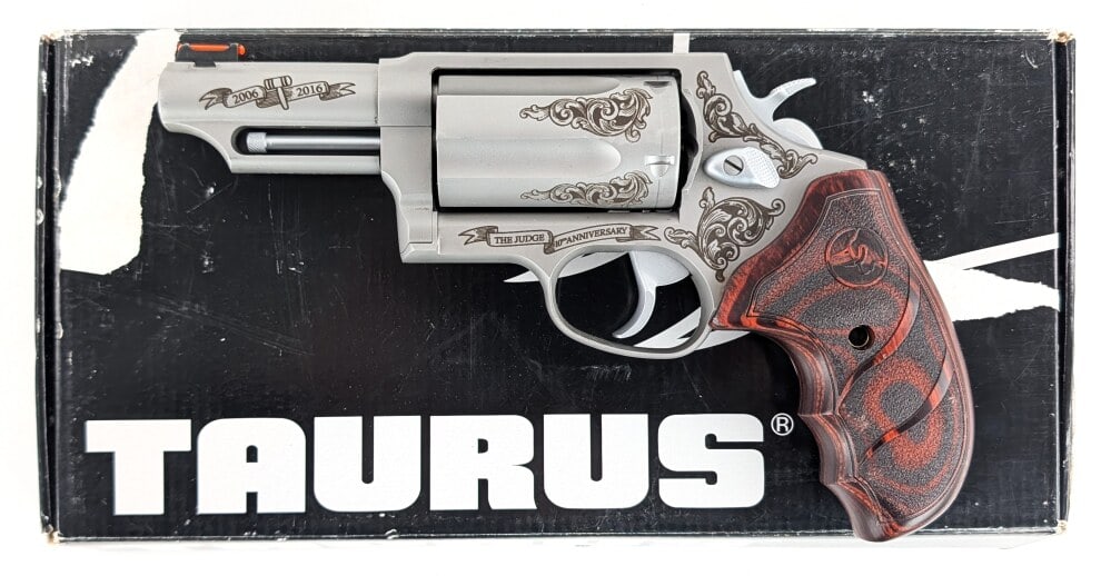 Taurus The Judge 10th Anniversary .45 LC / .410 Ga Revolver w/ Box: Manufacturer: Taurus, Model: The Judge, Type: Revolver, Caliber/Gauge: .45 Colt / .410 Ga, Barrel: 3 inch, Choke: , Finish: Stainless Steel, Grip: Ergonomic Wood, Stock: , Condition: Very nice with li