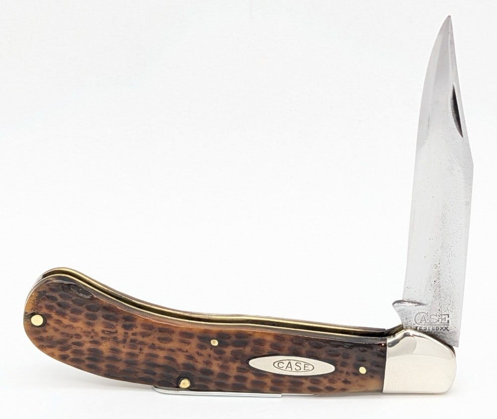 1920-40 Case Tested XX Green Bone Saddlehorn Knife 6100: Knife is in cleaned aged condition with heavy material loss and pitting on the blade, scuffs on the polished bolsters, a pin crack on the front handle scales lower pin, and a pin crack on the back han