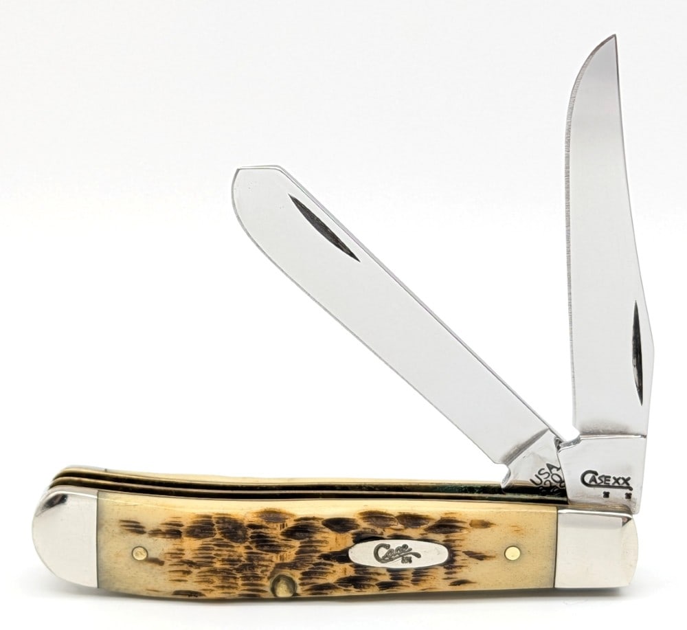 2008 Case XX Amber Bone Mini Trapper 6207: Knife is in nice condition with a pin crack on the back handle scale bottom pin. Overall measures 3-1/2in when closed.