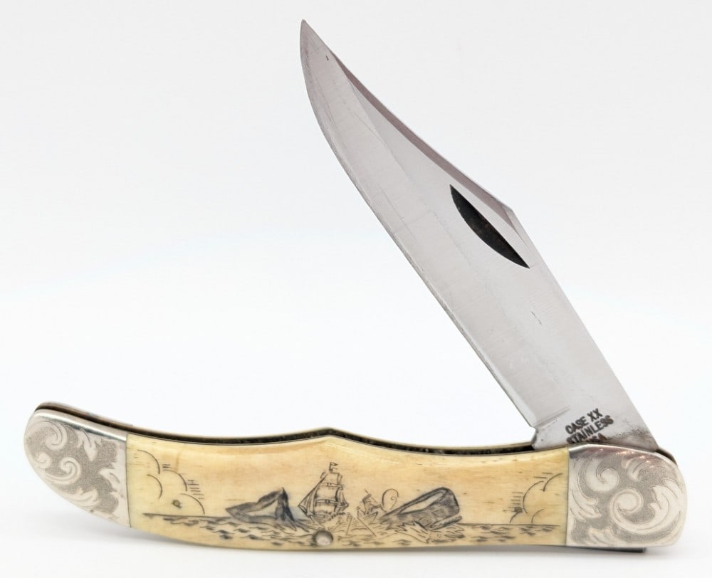 1977 Case XX Scroll Bolster Moby Dick Scrimshaw Bone Folding Hunter 6265: Knife is numbered C0359 and is in good condition with some scratches on the blade and scuffs on the bolsters from use. Overall measures 5-1/4in when closed.