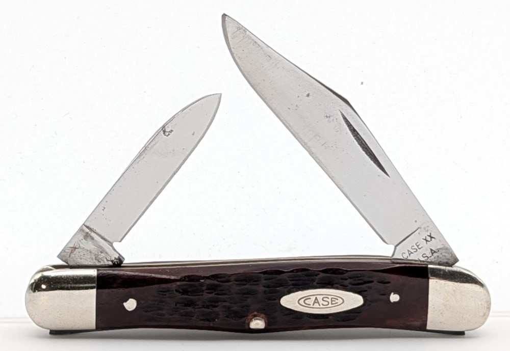 1965-69 Case XX Red Bone Whittler 6208: Knife is in nice condition with light scratches and carbon spots on the blades, and scuffs on the bolsters. Overall measures 3-1/4in when closed.