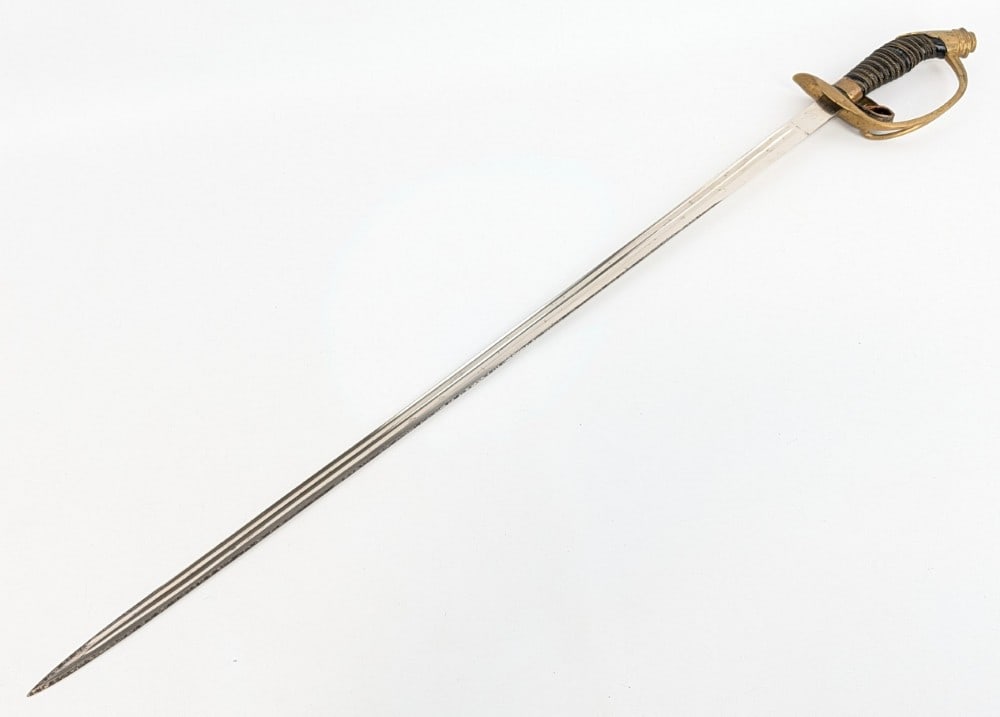 WWI Imperial German Prussian Unmarked M1889 Dress Sword: Features a mirror polished blade, a brass folding guard with the Prussian eagle, and a fluted leather handle with a brass wire wrap. Sword is in good condition with carbon spotting on the blade, scuff