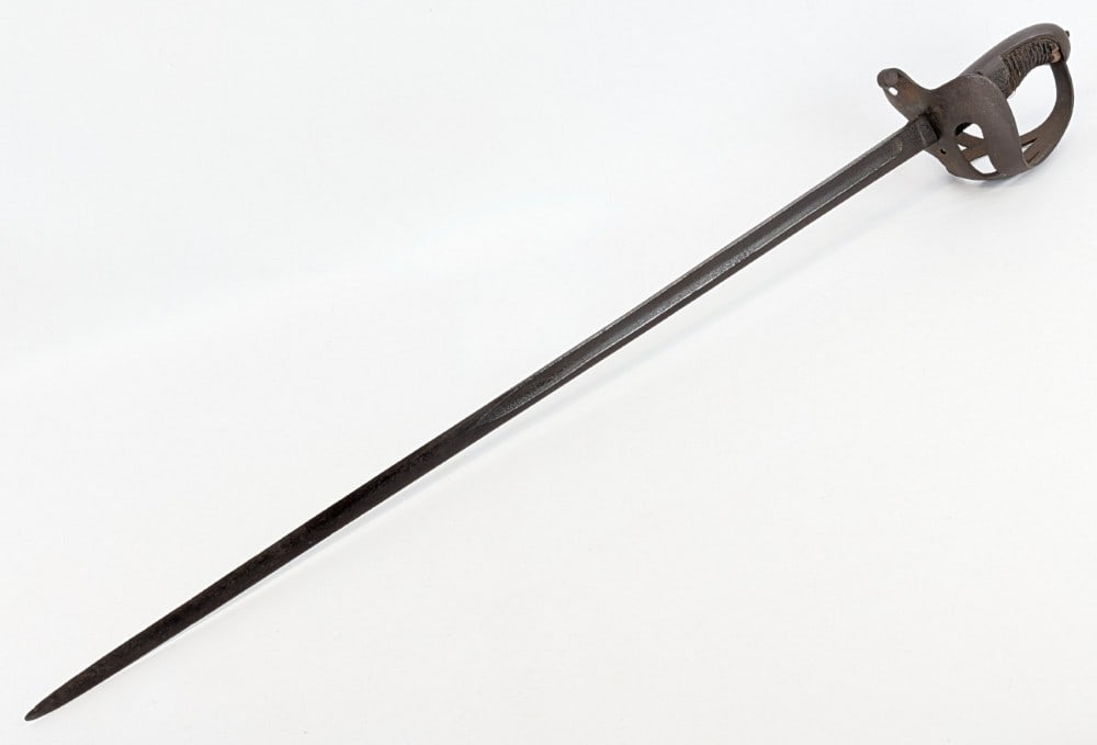 Prussian M1852 Basket Hilt Saber: Sword is in aged condition with heavy pitting on the blade, pitting on the guard, and cracking a wear on the leather wrapped handle. Blade length measures 29in and overall 35in. Ref #: 7067