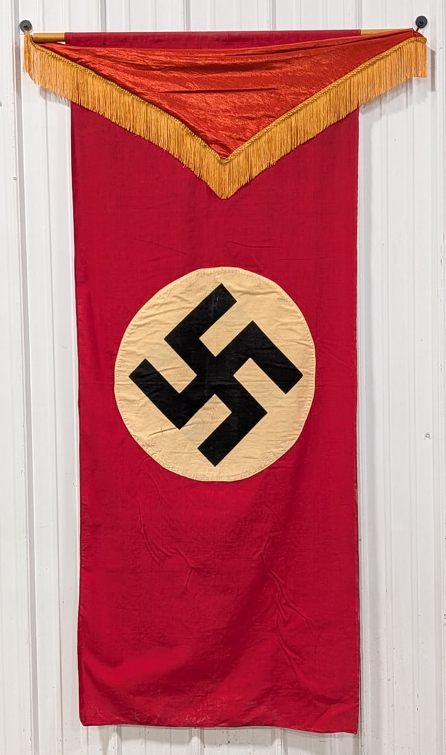 WWII German 6ft NSDAP Banner w/ Silk Tassel Topper: Flag is in nice condition with staining and discoloration on the white, a small hole at the pole fabric, and some thin spots in the fabric from wear and age. Measures 30in wide x 72in tall.