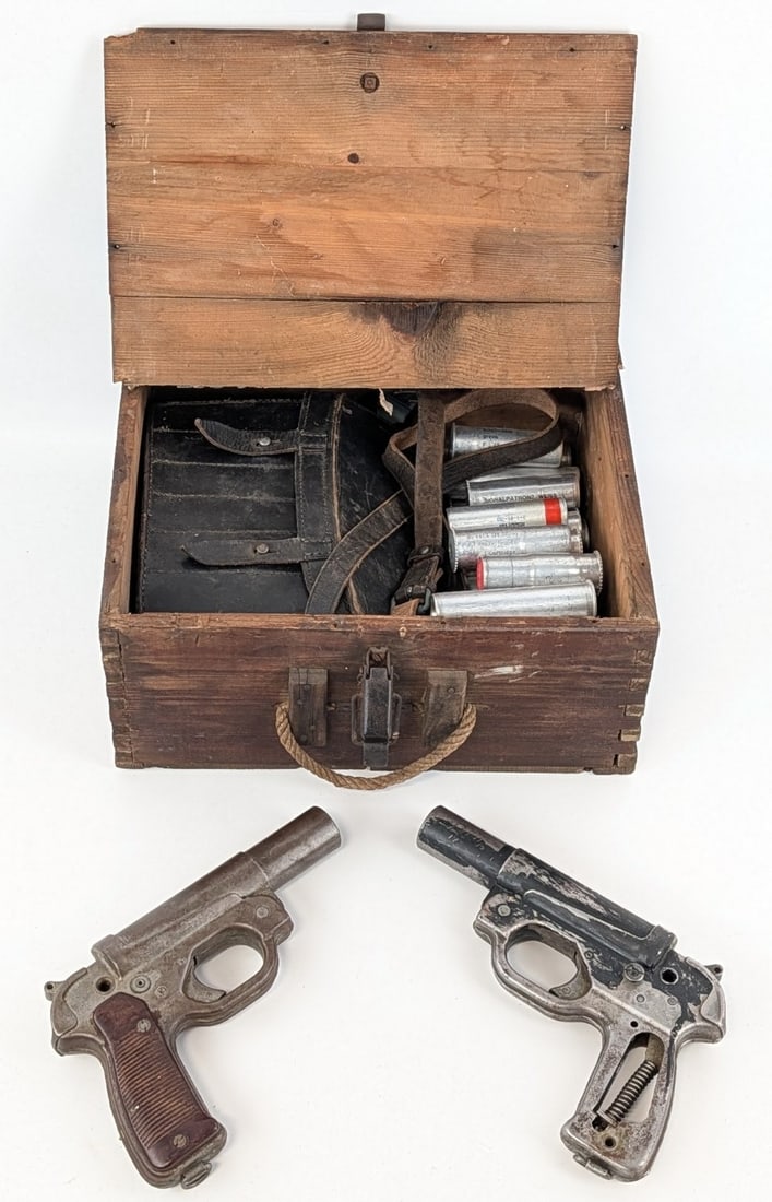 (2) WWII German M42 Flare Guns w/ Signal Flare Pouch & Flares in Case: Flare guns are marked wa for Hasag, Hugo Schneider AG, Abteilung Lampenfabrik, Leipzig. Includes the leather flare pouch carrier, and over 30 flares of various sizes. Flare guns are in aged condition 